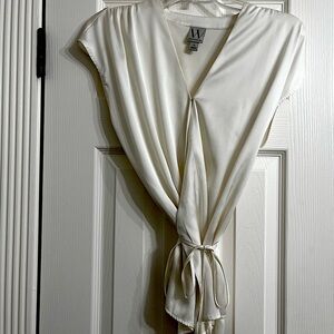 Beautiful silky cream colored blouse.